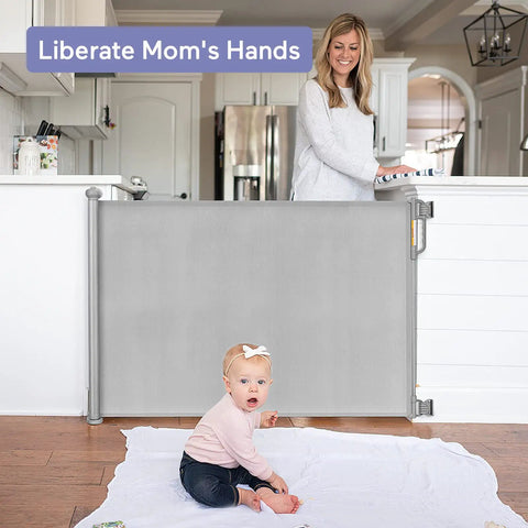 Retractable Mesh Baby Gate For Stairs And Doorways, Extra Wide Up To 71 Inches, installed in a kitchen doorway with child playing
