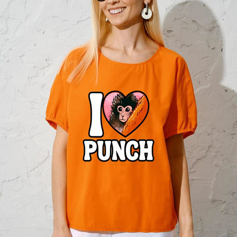 Woman wearing orange shirt with "I Love Punch" design, featuring Dope Monkey Heart graphic, part of DTF Transfers Pack For T Shirts 7x7.
