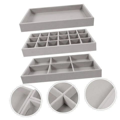 Three Piece Multi Grid Jewelry Organizer Trays Featuring Earring Stands Necklace Display Plates And Soft Velvet Ring Inserts To Make Sorting Your Bling A Breeze For Home Or Showroom Use. Grey trays stacked with soft velvet inner layers.