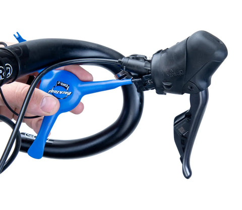 EWS-2 Bicycle Electronic Shift Tool For Shimano EW-SD3000 Wires And Batteries, shown on bike handle for wire installation.