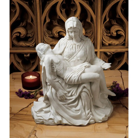 Pieta Replica Statue Large Bonded Marble Sculpture Inspired by Michelangelo, detailed view in home decor setting with candle
