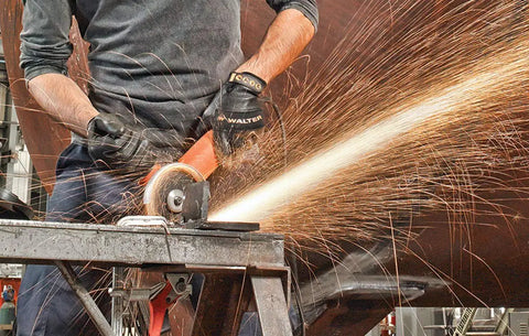 Cut Off Wheel Pack Of 25 For Angle Grinders, Beefy Performance Abrasive Wheel in use cutting metal, emitting sparks, close-up view.