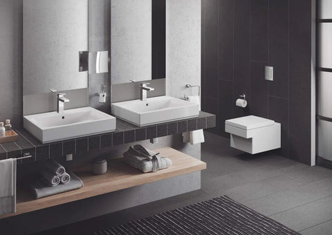 Modern bathroom with Essentials Cube Toilet Paper Holder In StarLight Chrome Sleek Metal Wall Mount With Concealed Fastening