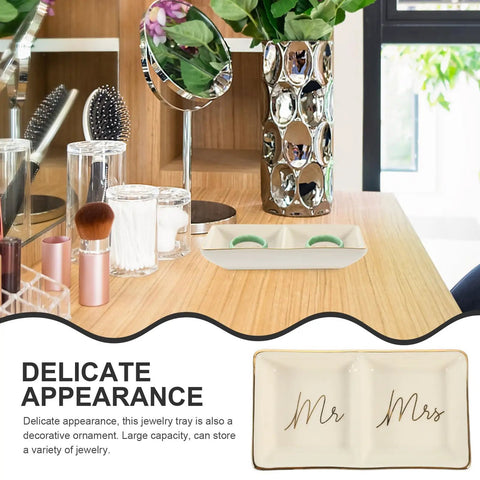 Stylish Gold Rimmed Ceramic Jewelry Tray With Double Grids To Organize Your Bling Keeps Rings Necklaces And Earrings Super Neat Chic Decorative Vanity Trinket Dish Fans Love on a wooden surface with decorative items.
