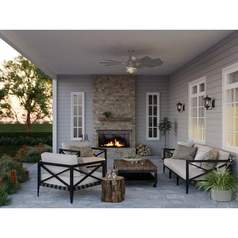 Chic Slick Farmhouse Ceiling Fan With A Tough Antique Nickel Finish And Massive Twelve Blade Windmill Design For That Fresh Modern Rustic Vibe Inside Open Living Spaces in a patio setting.