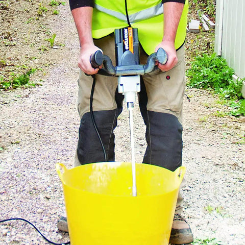 Person using Variable Speed Paddle Mixer For Cement And Concrete Mixes Including Epoxies Plaster Gypsum And More With Mixing Paddle No Mess Cleanup