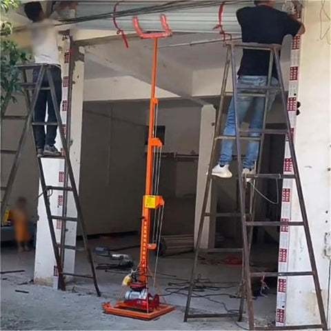 Compact Portable Cargo Lift Platform For Warehouses And Shops With Massive Load Capacity And Smooth Operation To Easily Move Heavy Goods Through Rolling Shutters Fast in use during installation with two workers on ladders.