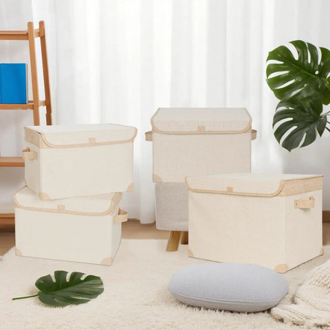 Kick Some Clutter To The Curb With These Roomy Foldable Storage Bins Featuring Tough Reinforced Side Panels And Snug Fitting Covers. Set of beige collapsible bins in a living room setting.