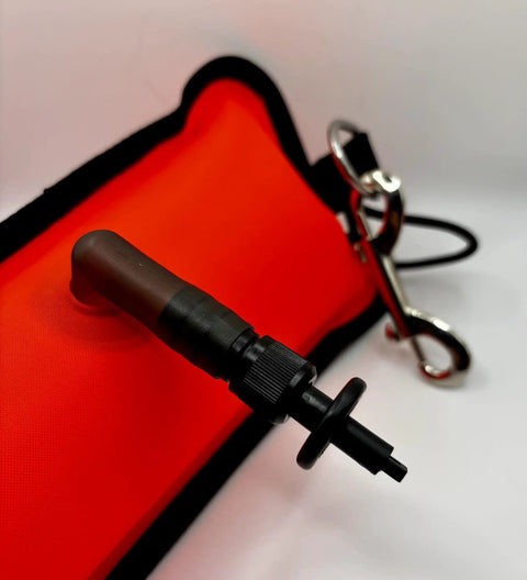 Close-up of scuba diving lift for spearfishing and lobstering with inflation valve, nylon material, and stainless steel stringer attachment.