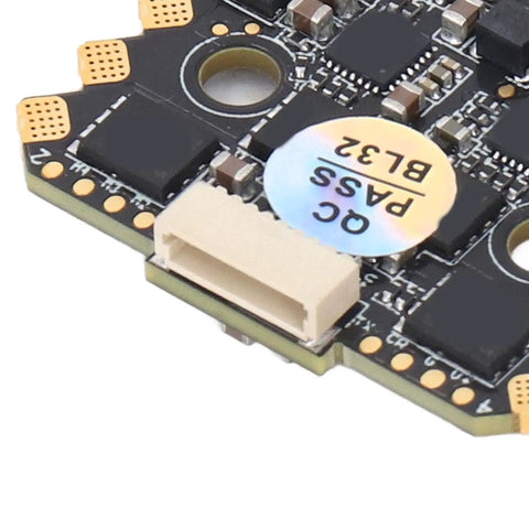 Close-up of BLHeli 32 4 In 1 ESC for FPV Drones, featuring 70A continuous, 150A peak, 20x20 stack, telemetry, and circuitry detail.