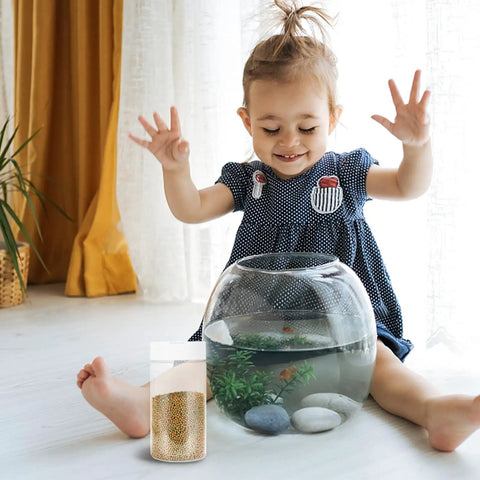 Get 2PCS Portable Fish Feeding Bottles With Screw Cap White Plastic Aquarium Food Storage for Automatic Tank Dispensing next to a happy child.