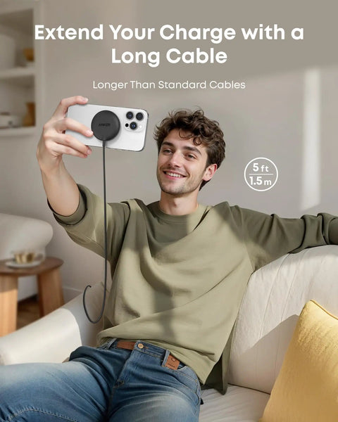 Man using Magnetic Wireless Charger Pad Qi2 Certified 15W MagSafe Compatible for iPhone with long cable on sofa