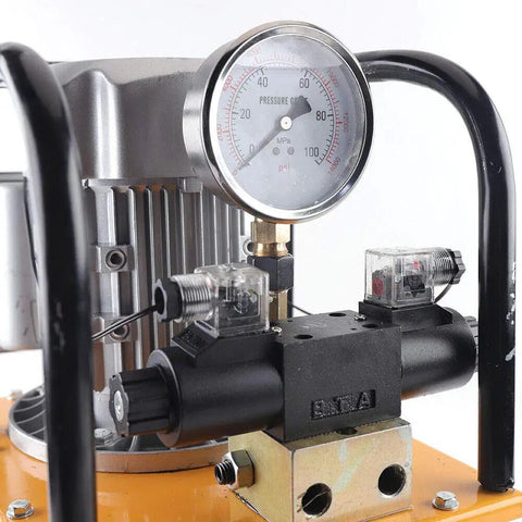 Close-up of Heavy Duty 750W Electric Hydraulic Pump 110V Double Acting Solenoid Valve 10000 Psi showing pressure gauge and solenoid valves.
