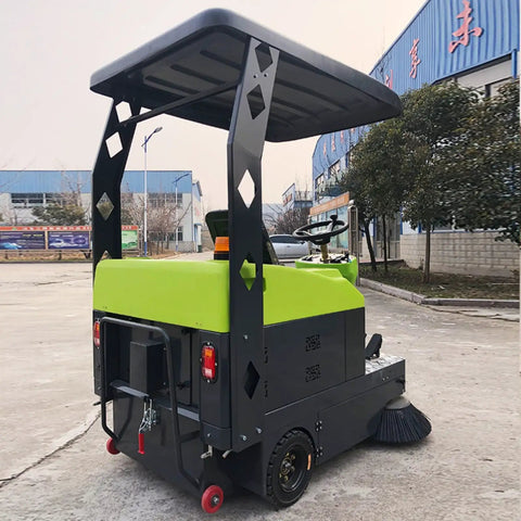Heavy Duty Ride on Commercial Sweeping Machine For Warehouse And Industrial Floor Cleaning, rear view with green and black design.