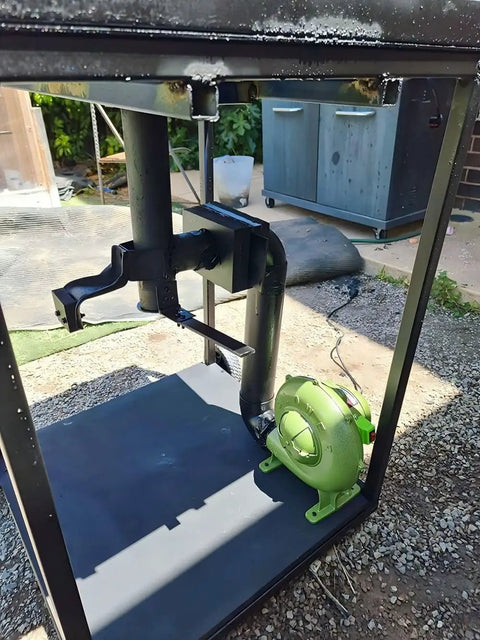 Variable Speed 110V 240CFM Forge Blower Fan With Airflow Controller, shown installed in a metal frame outdoors.