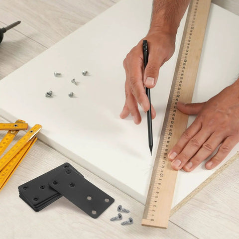 Person using ruler and pencil, stainless steel flat straight brackets with screw holes six pack on table, easy no welding install.