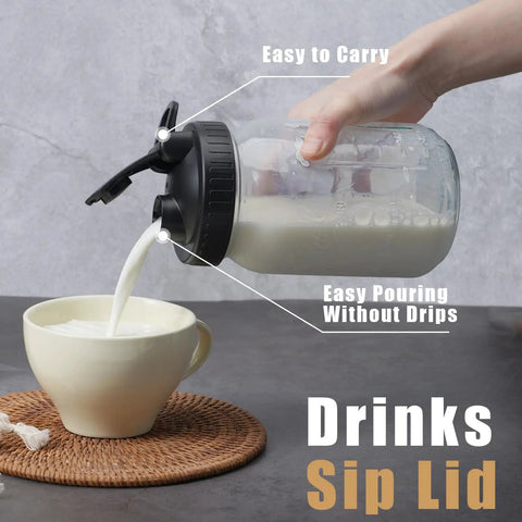 Total Game Changer Pour Spout Lids For Regular Mouth Mason Jars Heavy Duty Flip Caps Leak Proof Rubber Seal Zero Mess Liquid Dispenser For Coffee Tea Salad Dressing And Smoothies Black Four Piece Set pouring milk from jar into cup