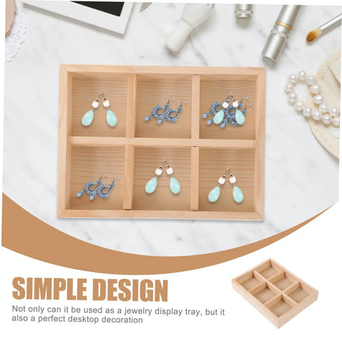 Six Compartment Wood Jewelry Tray With Multi Grid Layout For Rings And Bracelets Rustic Countertop Trinket Dish displaying blue earrings.