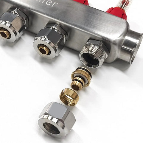 Close-up of Four Loop PEX Radiant Manifold for Hydronic Floor Heating with half inch connectors and stainless steel construction.