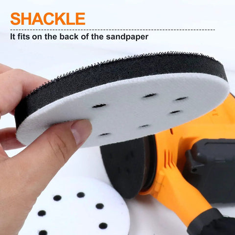 Hand holding 5 Inch 8 Hole Interface Pad for 5 Inch Orbital Sander with Hook and Loop Backing Soft Foam Cushion Buffing Pads Dust Busting Sanding Pad Pro Grade Pack Of 2