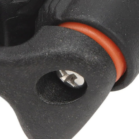 Close-up of Heavy Duty Rope Cam Cleat With Kickass Quick Release Grip, featuring orange seal and progressive teeth for marine use.