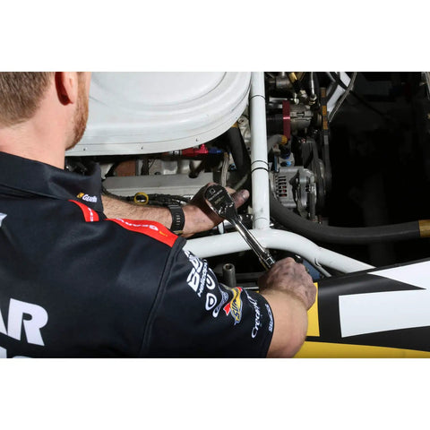 Mechanic using Three Eighth Inch Drive 120XP Teardrop Ratchet Eight And A Quarter Inch Length Sixty Tooth Gear on engine
