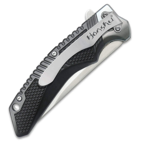 Badass 4 Inch D2 Tool Steel Flipper Pocket Knife Wowing Users With Smooth Ball Bearing Opening Action And Rugged Textured Grip, close-up view.