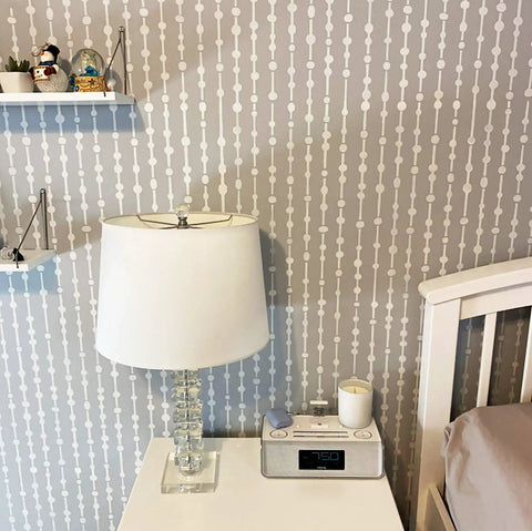 Dew Drops XL Wall Stencil 24 X 39.5 In For Large Geometric Wall Patterns with lamp beside bed and decorative shelves