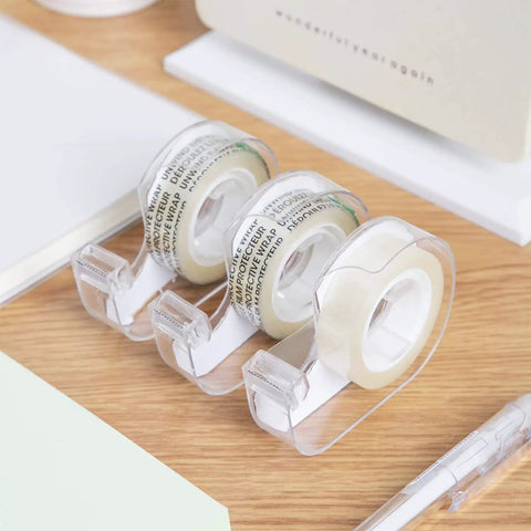 Double Sided Tape With Dispenser, 1/2 Inch Wide, Permanent Adhesive, 252 Inches Long, Translucent Roll, 3 Pack on wooden desk.