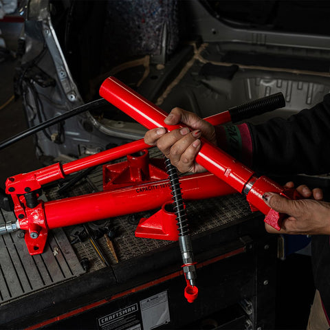 10 Ton Hydraulic Porta Power Jack Ram Badass Auto Body Frame Repair Tool Heavy Duty Carbon Steel components on workbench.