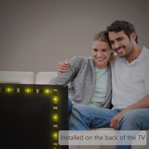 Couple enjoying TV with TV Backlight LED Strip For 32 To 65 Inch TVs, USB RGB Light Strip 13.2 Foot With App Control And Remote.