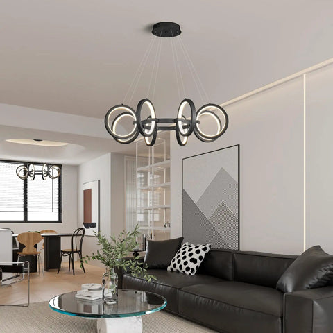 Dope Modern LED Chandelier With Six Black Ring Pendant Lights hanging in a living room