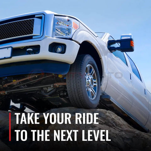 Pickup truck on rocky terrain showcasing off-road capability, with a focus on rugged design and high clearance.