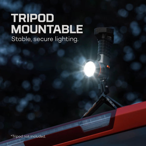 LuxTreme SL50 Spotlight With 450 Lumens Half Mile Beam Waterproof LED Flashlight mounted on tripod, illuminating outdoors.