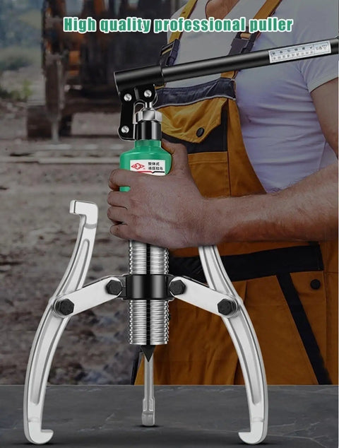 Heavy Duty 30 Ton Hydraulic Puller And Wheel Bearing Separator With Two Or Three Adjustable Jaws used by a mechanic in a workshop.