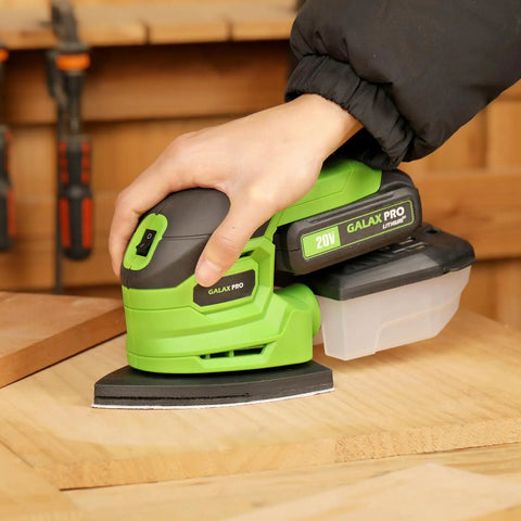 Person using Garage Shop Ready Compact Detail Sander With 1.1A Motor Delivers 14,000 OPM For Smooth Woodworking on wood surface