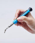 Hand holding a screw with Pro Grade All In One Magnetic Precision Screwdriver Set With 51 Pieces For Electronics Repair