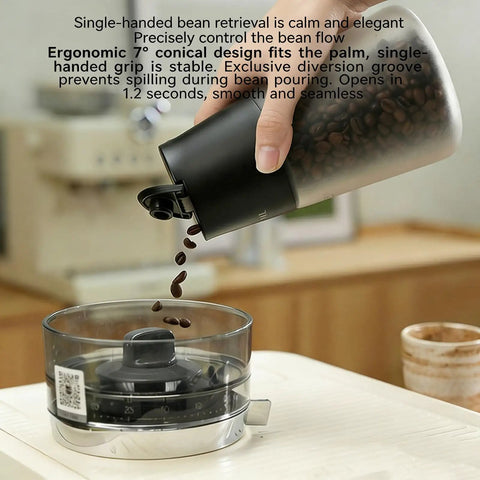 Smart Vacuum Sealed Coffee Canister With Digital Display And Humidity Monitor, 650Ml pouring coffee beans into measuring cup.