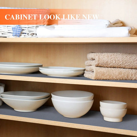 Non Adhesive Shelf Liner For Kitchen Cabinets And Drawers Features a gray anti-slip pattern under plates and towels.