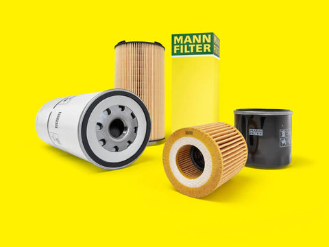 Various oil filters including W 719 30 Spin On Oil Filter Replacement For VW Golf GTI Jetta Passat Audi A6 S4 on a yellow background