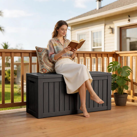 Person sitting on 90 Gallon Waterproof Deck Box With Lockable Lid For Patio Storage Cushions Pool Gear Garden Tools And Packages Weatherproof Resin Outdoor Storage Bench