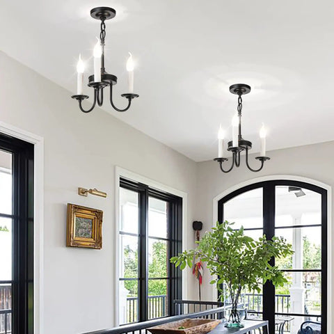 Three Light Farmhouse Candle Style Chandelier For Entryways, Dining Rooms, And Kitchen Islands in black finish in dining area
