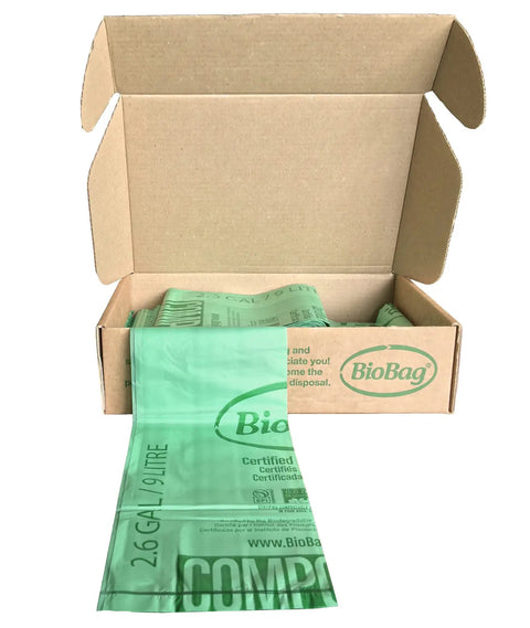 Heavy Duty Compostable Food Scrap Bags 100 Count in a open box, biodegradable kitchen liners 2.6-GAL size for food waste.