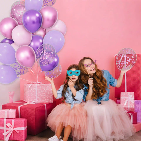 Two girls wearing masks with Sixty Eight Piece Pink And Purple Balloons Set 12 Inch Metallic Latex Party Decor for celebration.