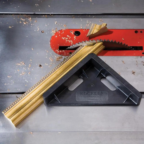 45 Degree Miter Sled For Table Saw With Beefy Durability And Low Friction Sliding Fits Standard Three Eighths By Three Quarters Inch Miter Slot Fence Accessory For Precise 90 Degree Cuts in use on a table saw making miter cuts on a wooden frame.
