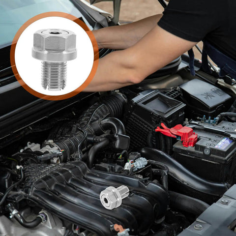 Upgrade Your Engine Maintenance With This Top Tier Self Tapping Oil Drain Plug Repair Kit Featuring Durable Sealing Gaskets For A Leak Free Seal And Easy Installation On Any Car To Get You Back On The Road In No Time. silver self tapping oil drain plug repair kit in car engine bay