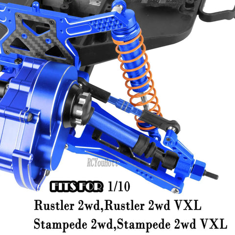 Close-up of navy blue 1/10 Rustler 2WD And Stampede 2WD Beefed Up RC Suspension Arm Kit with big bore shocks and drive shaft.