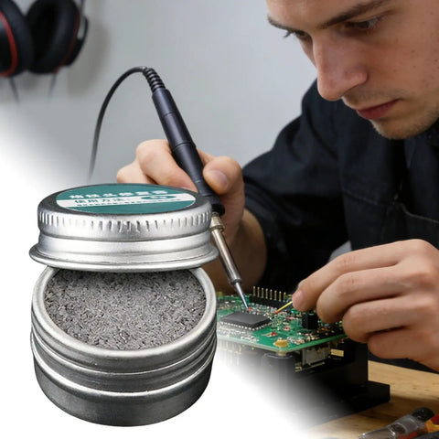Man using soldering iron and tip cleaner for oxidation removal keeps soldering iron tips active in electronics repair workshop
