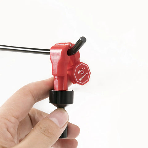 Top Shelf N52 Neodymium Magnet Key Set Slick Grip showing a hand holding a red textured tool with stop lock feature.