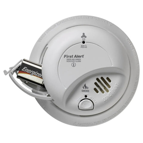 Top Shelf Game Changer Smoke And Carbon Monoxide Detector With Heavy Duty Ionization Chip And Nine Volt Battery Plug And Play Setup Interconnect Ready For Total Home Safety, white ceiling mounted unit with battery.